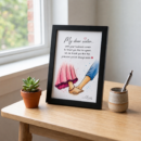 Framed watercolour of a brother and sister holding hands, above a handwritten note beginning “My dear sister”